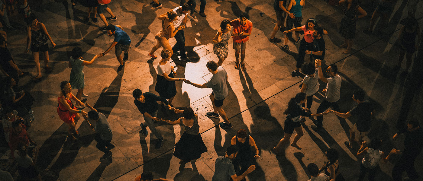 Couples salsa dancing in a hall