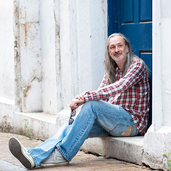 Dating photo of man sitting in doorway