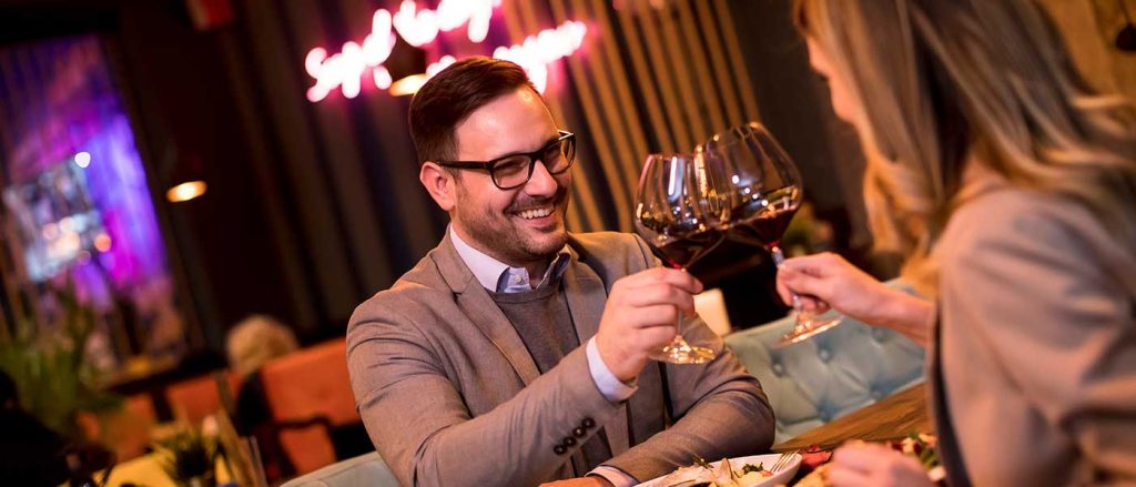 Two people enjoying dinner together at a Table for two event