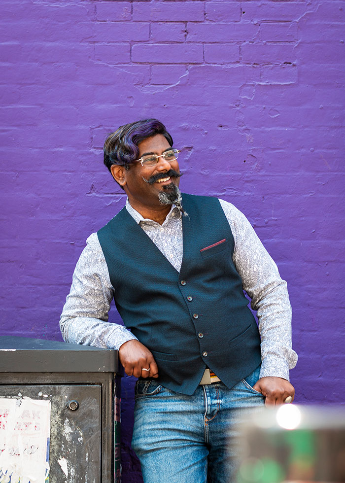 Dating photo of a male in front of a purple wall - - taken by Gemma Wilks